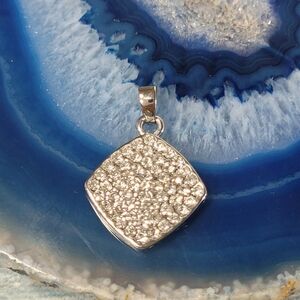 Elegant Silver Pendant with Rhinestones.